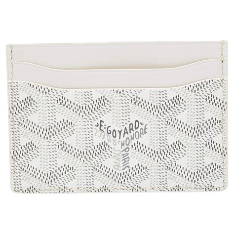 white goyardine card holder.